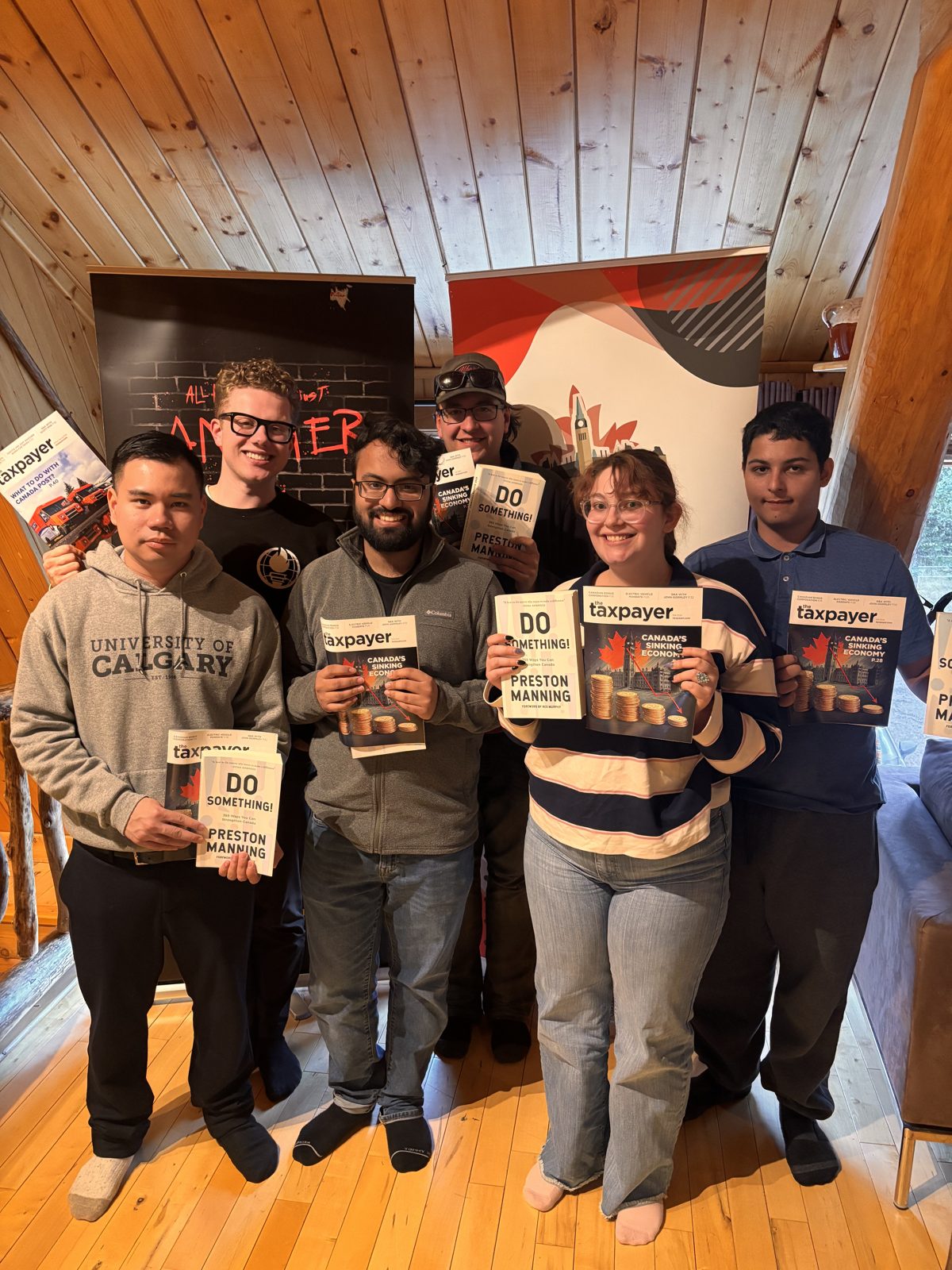 Generation Screwed student leaders holding campaign pamphlets